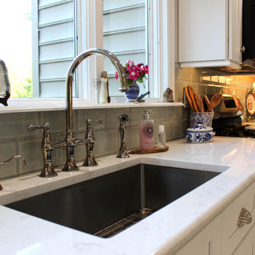 Transitional White Shaker Kitchen With White Marble Look Floor & Countertop