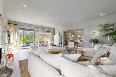 Inspiration for a mid-sized modern open concept ceramic tile living room remodel in Other with gray walls