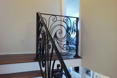 Scroll style custom ornamental iron stair rails
