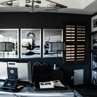 This is an example of a large modern study in Las Vegas with grey walls, porcelain flooring, no fireplace and a freestanding desk.