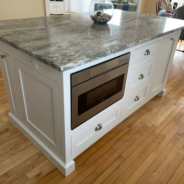 Microwave and cookie sheet cubby inserted in the  center island