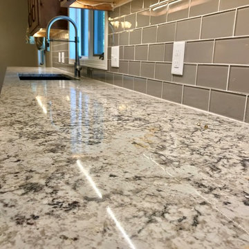 Dura Supreme Cabinets Knotty Alder Butternut Romanix Granite Galley Kitchen