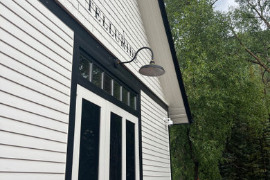 This is an example of a mid-sized transitional porch design in Denver.