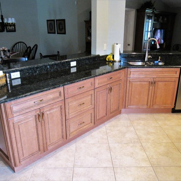 Galaxy Pecan cabinets with peacock green granite
