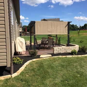 Patio pergola/custom sitting seat-walls/aptio staining/professional landscaping
