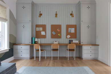 Kids' study room - transitional gender-neutral light wood floor, beige floor and shiplap wall kids' study room idea in San Francisco with gray walls