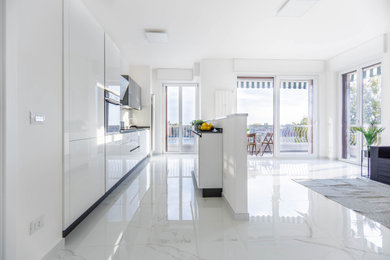 Design ideas for a modern kitchen in Milan with porcelain flooring.