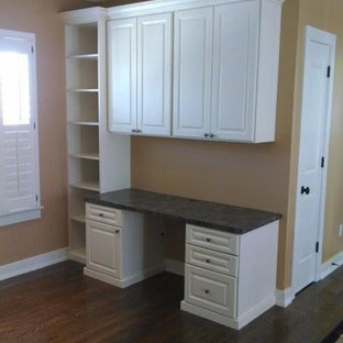 Photo of a medium sized modern study in Louisville with orange walls, dark hardwood flooring, no fireplace, a freestanding desk and brown floors.