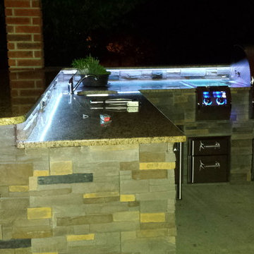 L Shaped Outdoor Kitchen With Unique Lighting