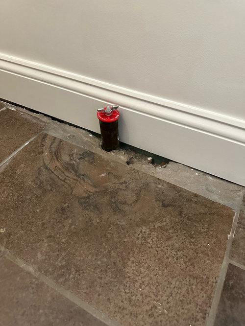 How to fill gaps in tile around a pipe?