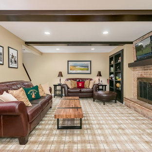 Design ideas for an expansive traditional look-out basement in Chicago with yellow walls, carpet, a standard fireplace, a brick fireplace surround and multi-coloured floors.