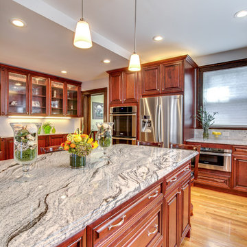 Viscont White granite countertops with Cherry cabinets