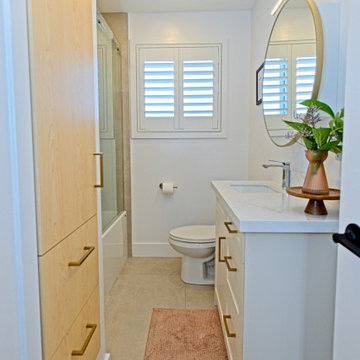 Bathroom with Custom Linen Cabinet and Round Vanity Mirror | The Junction