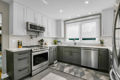 Inspiration for a transitional u-shaped ceramic tile eat-in kitchen remodel in Ottawa with an undermount sink, shaker cabinets, quartz countertops, marble backsplash and stainless steel appliances