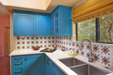 This is an example of a small transitional kitchen in Phoenix.
