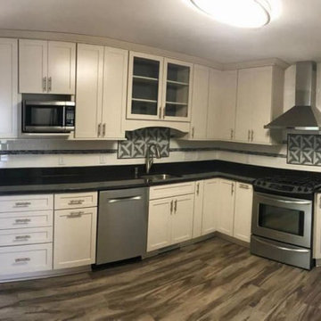 White Cabinet kitchen with black countertop