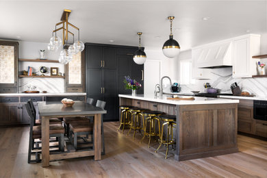 Mid-sized transitional l-shaped eat-in kitchen in Other with an undermount sink, recessed-panel cabinets, dark wood cabinets, quartz benchtops, white splashback, engineered quartz splashback, panelled appliances, medium hardwood floors, with island, brown floor and white benchtop.