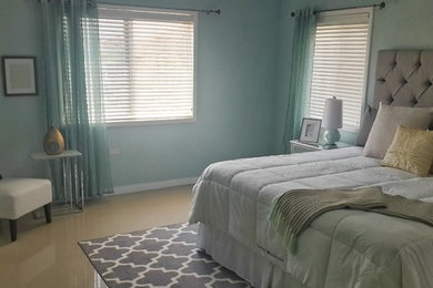 Bedroom - contemporary master bedroom idea in Other with blue walls