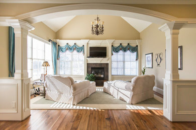 Mid-sized transitional formal and enclosed medium tone wood floor living room photo in Raleigh with beige walls, a standard fireplace, a tile fireplace and a wall-mounted tv