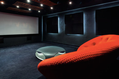 Photo of a contemporary home cinema in Surrey.