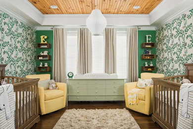 Nursery - mid-sized traditional gender-neutral dark wood floor and brown floor nursery idea in Charlotte with green walls