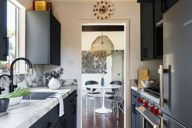 Kitchen - mid-sized contemporary light wood floor kitchen idea in San Francisco with a single-bowl sink, flat-panel cabinets, gray cabinets, marble countertops, marble backsplash and stainless steel appliances