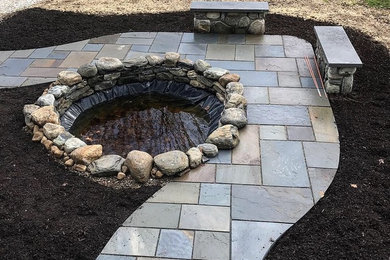 This is an example of a front yard stone landscaping in Other.