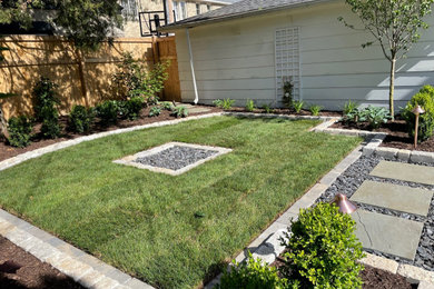 This is an example of a small modern backyard garden for summer in Milwaukee.