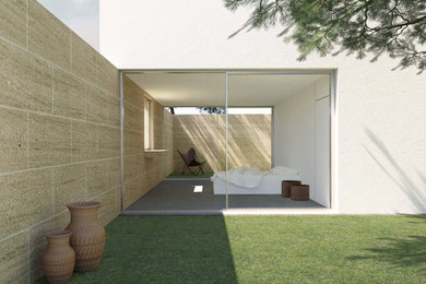 Exemple d'une grande chambre parentale tendance avec un mur blanc, sol en béton ciré, aucune cheminée et un sol gris.