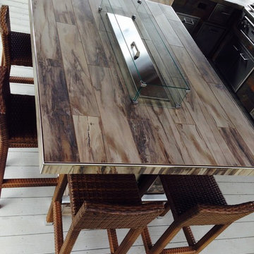 Tiled - wooden finish - fire table custom build by Sunset Outdoor LIving, LLC.
