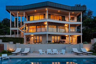 Example of a minimalist three-story house exterior design in Austin