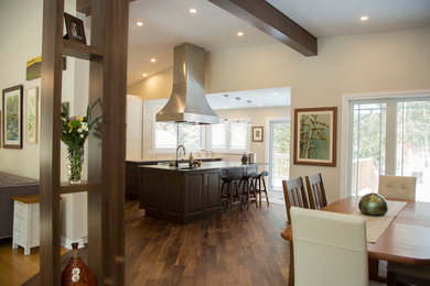 Eat-in kitchen - large galley medium tone wood floor and brown floor eat-in kitchen idea in Ottawa with beige backsplash and an island
