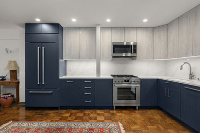 Inspiration for a contemporary dark wood floor kitchen remodel in New York with a drop-in sink, quartzite countertops, white backsplash, stainless steel appliances and white countertops