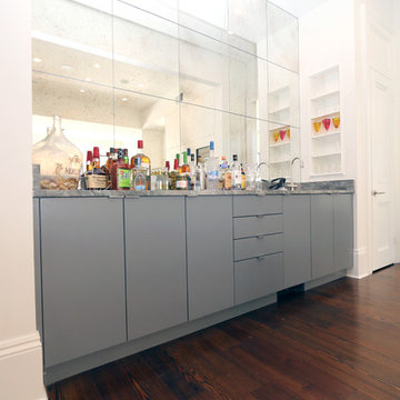 Contrasting Bar Cabinet Gives Flavor to this White Kitchen