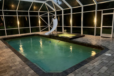 Inspiration for a coastal pool remodel in Tampa