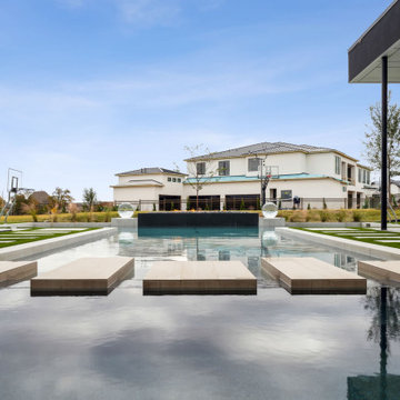 Modern Luxury Pool with Floating Paver Steppers by Radelli Designs