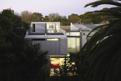 Inspiration for a contemporary three-storey exterior in Sydney.