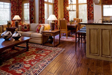 Example of a mid-sized classic open concept medium tone wood floor and brown floor family room design in Salt Lake City with beige walls, no fireplace and no tv