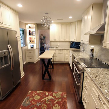 Medallion Painted White Chocolate Kitchen Cabinets with Petal Mosaic Backsplash