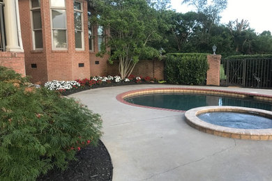 Inspiration for a large traditional drought-tolerant and full sun backyard concrete paver landscaping in Other with a fire pit for summer.