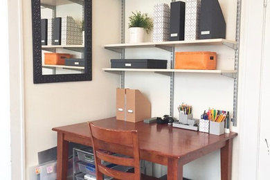 Study room - mid-sized contemporary freestanding desk medium tone wood floor study room idea in Austin with beige walls