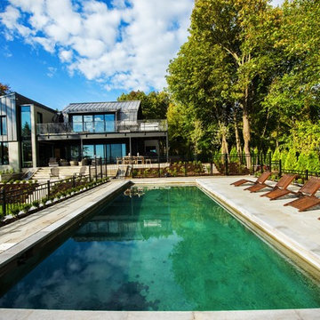 Contemporary pool and backyard in Pointe-Claire