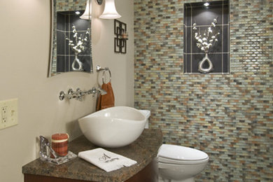 Powder room - mid-sized contemporary beige tile ceramic tile and gray floor powder room idea in Philadelphia with flat-panel cabinets, dark wood cabinets, a two-piece toilet, beige walls and a vessel sink
