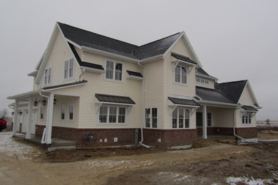 Example of a farmhouse exterior home design in Other