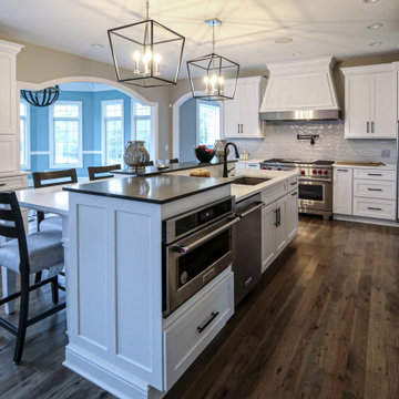 White Transitional Kitchen with Black Hardware and Glass Tile Backsplash
