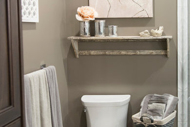 Inspiration for a mid-sized contemporary master beige tile and ceramic tile ceramic tile doorless shower remodel in Toronto with recessed-panel cabinets, dark wood cabinets, a one-piece toilet, beige walls, an undermount sink and granite countertops