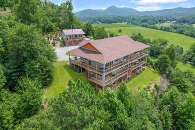 Inspiration for a craftsman three-story exterior home remodel with a mixed material roof