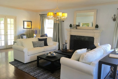 Living room - mid-sized traditional formal and open concept dark wood floor living room idea in Los Angeles with blue walls, a standard fireplace, a tile fireplace and no tv