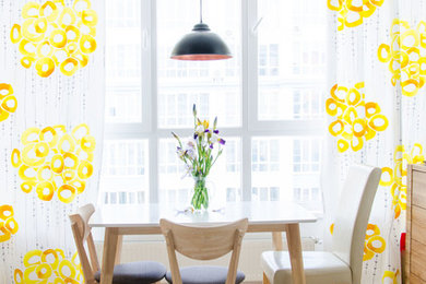 Example of a danish dining room design in Other