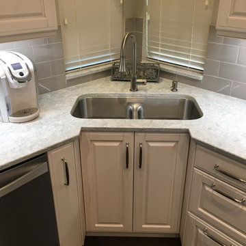 Recessed corner sink cabinet, with a low-divide sink set in Montgomery counter